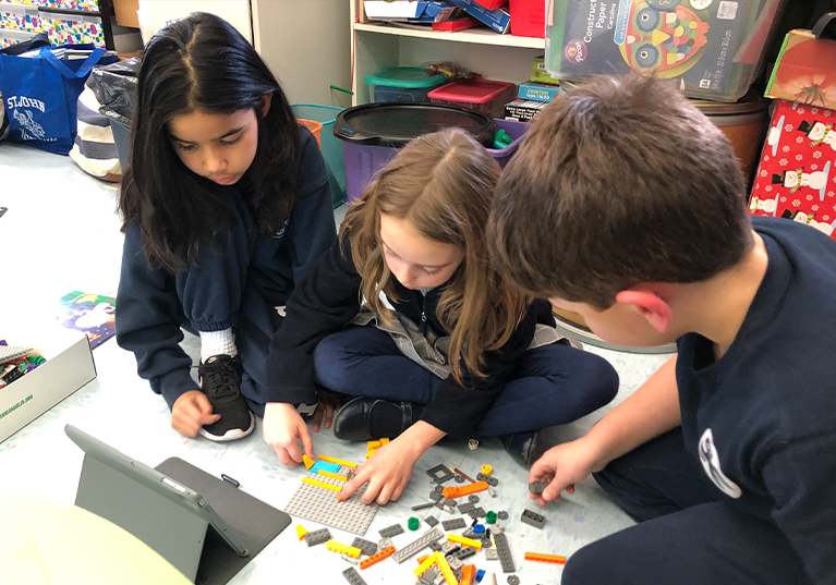 St. John students putting together Legos
